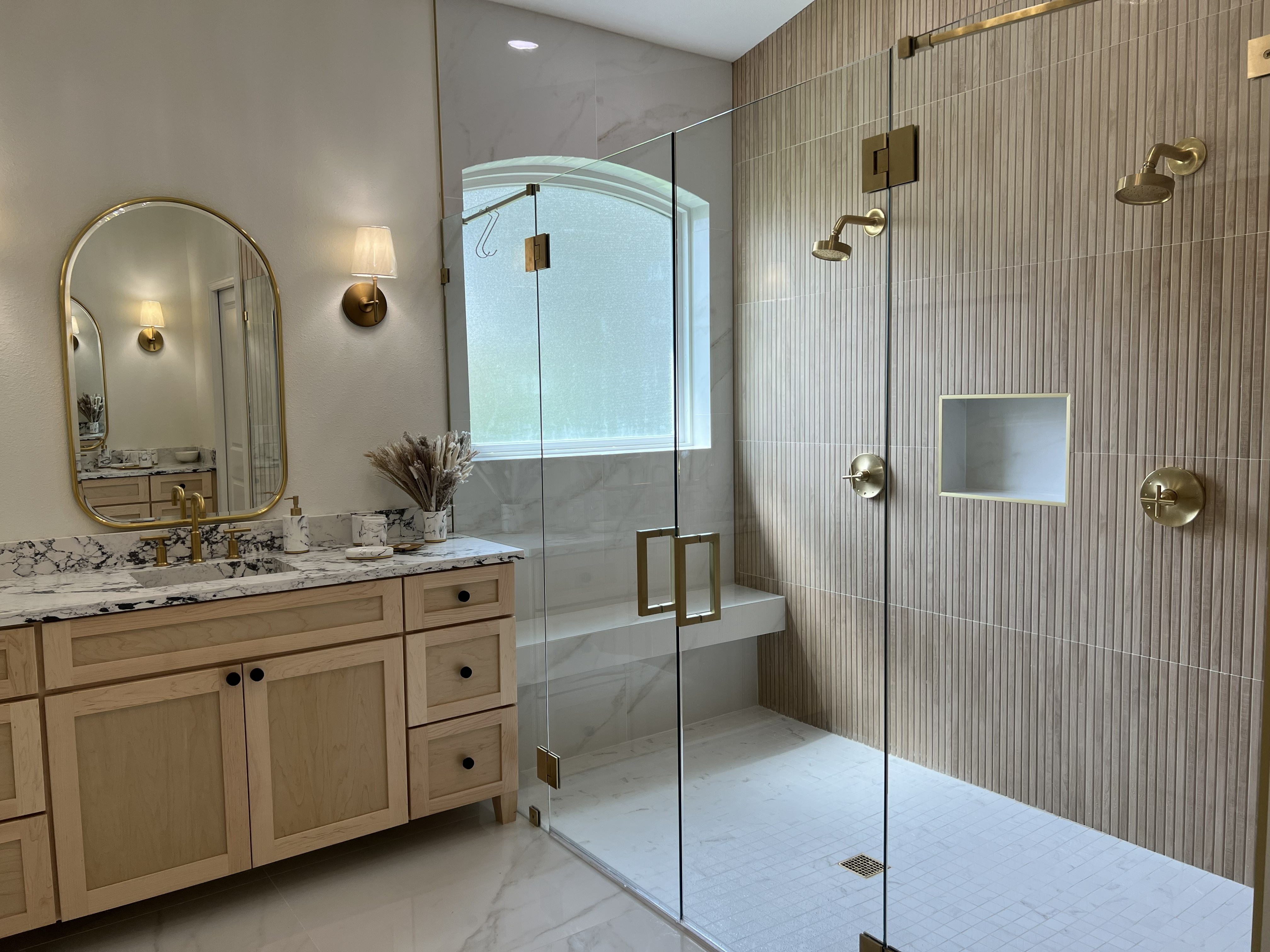 Remodeled bathroom with custom vanity and double shower